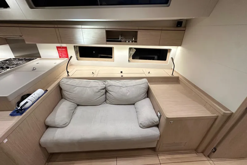 Champagne Yacht Photos Pics Interior of 2021 Beneteau Oceanis 55.1 yacht with cozy seating and modern design.