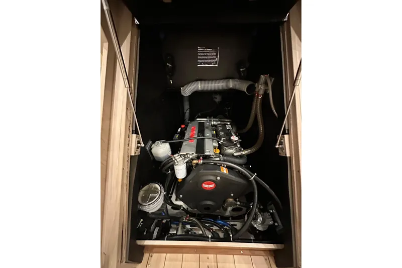 Champagne Yacht Photos Pics Engine compartment of 2021 Beneteau Oceanis 55.1 sailboat, showcasing mechanical components.
