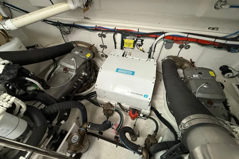  Yacht Photos Pics Engine room of 2022 Cruisers Yachts 50 Cantius with Seakeeper 6 stabilizer system.