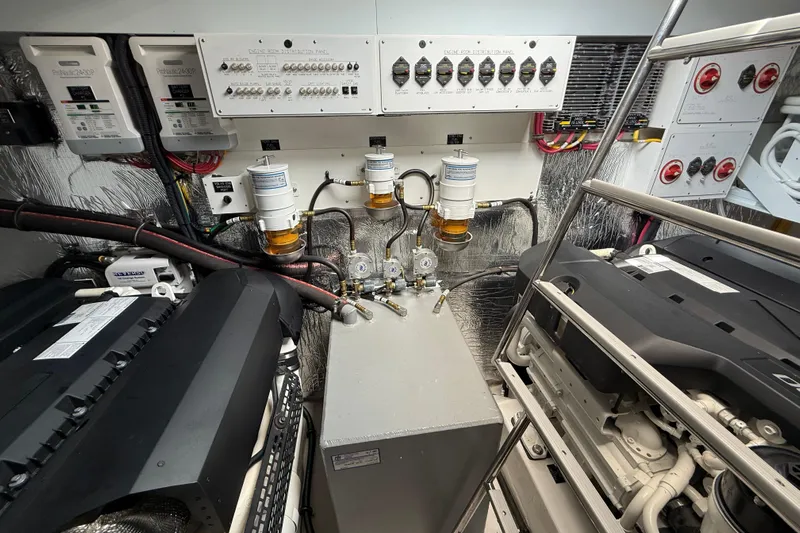  Yacht Photos Pics Engine room of 2022 Cruisers Yachts 50 Cantius, showcasing machinery and control panels.