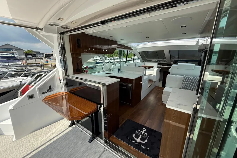  Yacht Photos Pics Luxurious interior of 2022 Cruisers Yachts 50 Cantius with modern design and elegant furnishings.