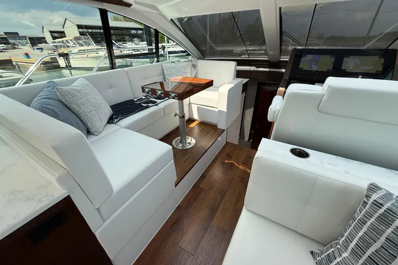  Yacht Photos Pics Luxurious interior of 2022 Cruisers Yachts 50 Cantius with elegant seating and modern design.