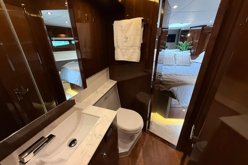  Yacht Photos Pics Luxurious bathroom and bedroom interior of 2022 Cruisers Yachts 50 Cantius.