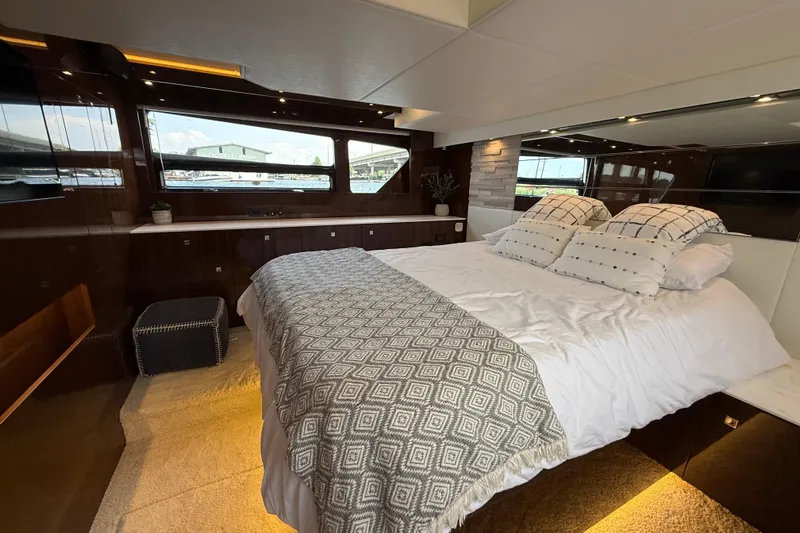  Yacht Photos Pics Luxurious bedroom interior of 2022 Cruisers Yachts 50 Cantius with elegant bedding and modern design.