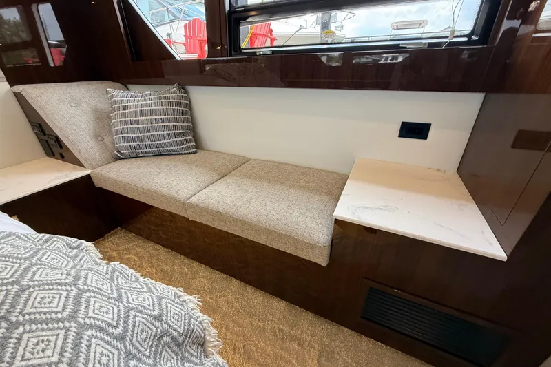  Yacht Photos Pics Luxurious interior seating in 2022 Cruisers Yachts 50 Cantius with plush cushions and elegant design.