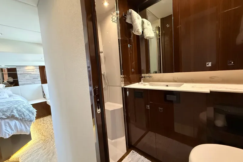  Yacht Photos Pics Luxurious bathroom and bedroom interior of 2022 Cruisers Yachts 50 Cantius.