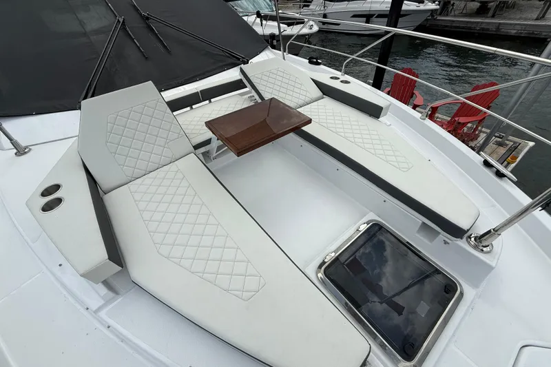  Yacht Photos Pics Luxurious 2022 Cruisers Yachts 50 Cantius with elegant deck seating and table.