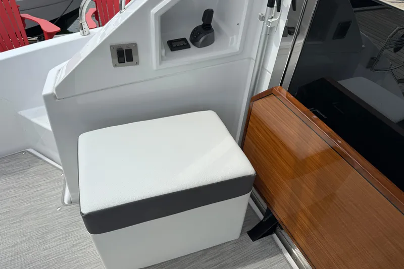  Yacht Photos Pics 2022 Cruisers Yachts 50 Cantius interior with white seating and control panel.