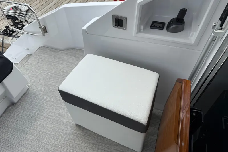  Yacht Photos Pics 2022 Cruisers Yachts 50 Cantius cockpit with seating and control panel.