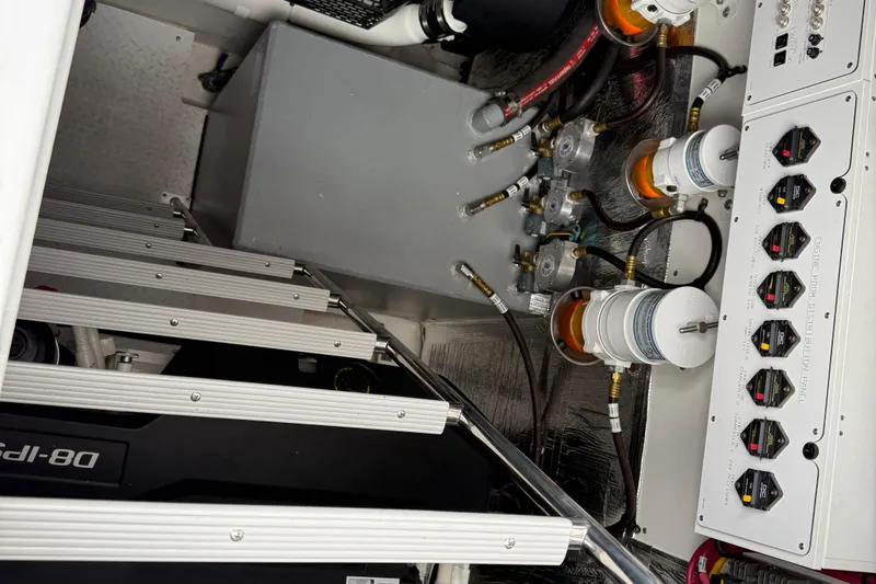  Yacht Photos Pics Engine room of 2022 Cruisers Yachts 50 Cantius with control panel and components.