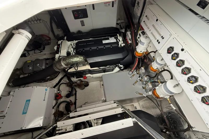  Yacht Photos Pics Engine room of 2022 Cruisers Yachts 50 Cantius, featuring Volvo Penta engine and control systems.