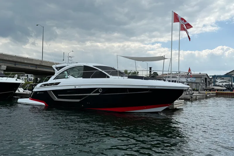  Yacht Photos Pics 2022 Cruisers Yachts 50 Cantius docked, featuring sleek design and Canadian flags.