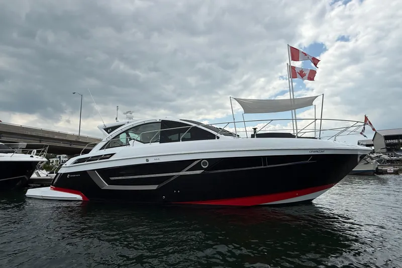  Yacht Photos Pics 2022 Cruisers Yachts 50 Cantius boat docked, featuring sleek design and Canadian flags.