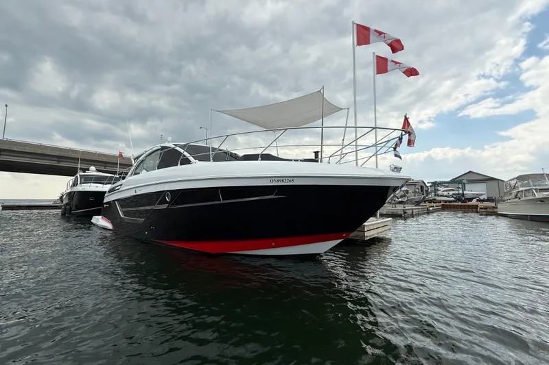  Yacht Photos Pics 2022 Cruisers Yachts 50 Cantius docked, featuring sleek design and Canadian flags.