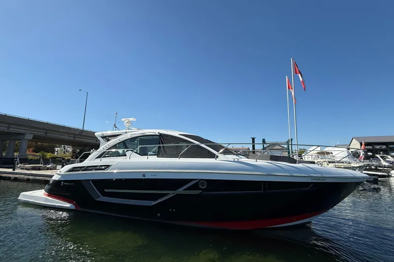  Yacht Photos Pics 2022 Cruisers Yachts 50 Cantius docked under clear blue sky.