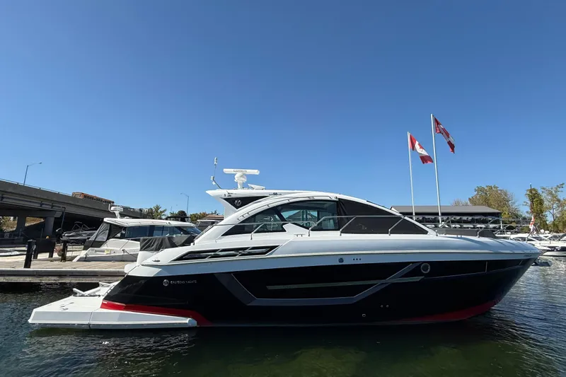  Yacht Photos Pics 2022 Cruisers Yachts 50 Cantius docked, featuring sleek design and Canadian flags.