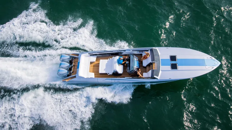  Yacht Photos Pics Aerial view of 2005 Nor-Tech 420 Monte Carlo speedboat cruising on water.