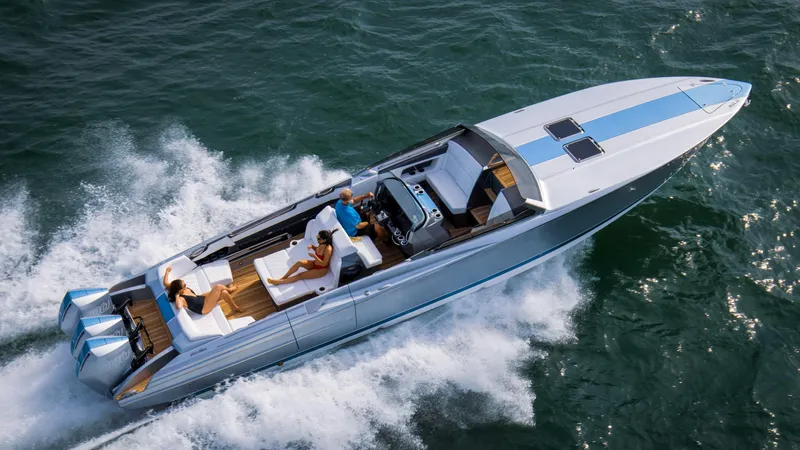  Yacht Photos Pics 2005 Nor-Tech 420 Monte Carlo speedboat cruising on open water, aerial view.