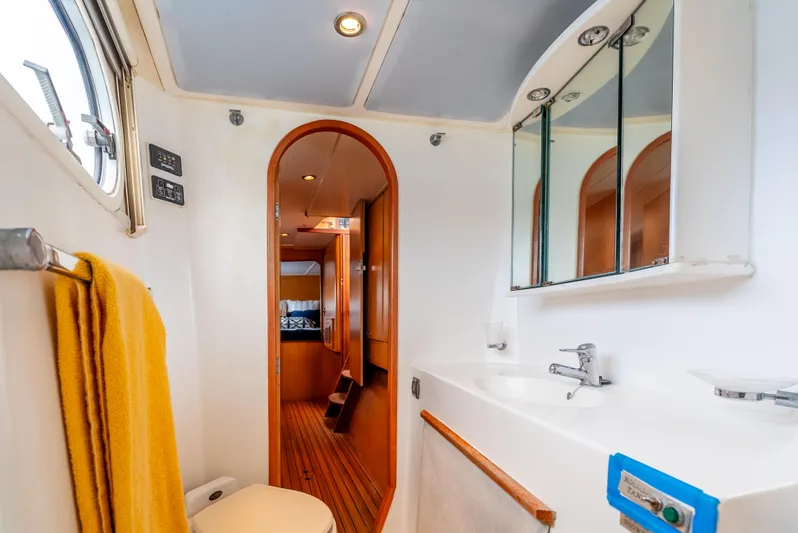 Nina May Yacht Photos Pics Catana 431 yacht bathroom, 2001 model, featuring modern fixtures and wooden accents.