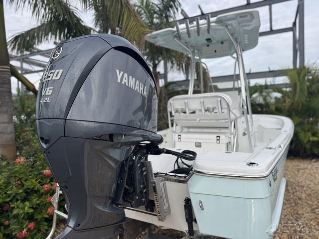 2025 BlackJack 224 boat with Yamaha V6 engine, parked outdoors.