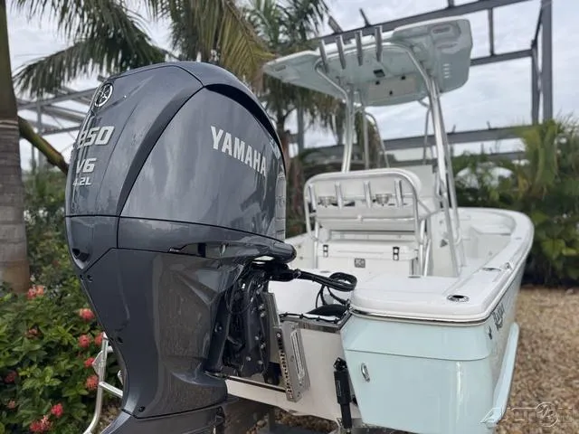 2025 BlackJack 224 boat with Yamaha V6 engine, parked outdoors.