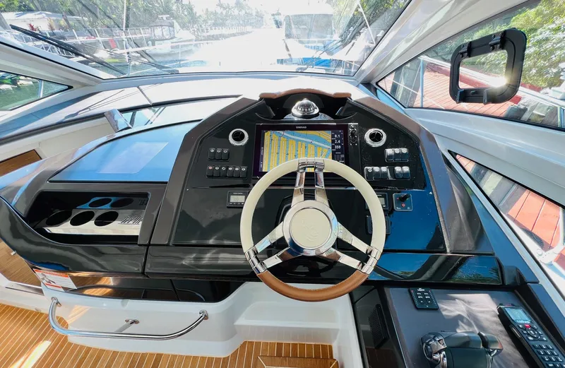 Elixir Yacht Photos Pics Helm of 2019 Beneteau Gran Turismo 46 yacht with modern navigation controls.