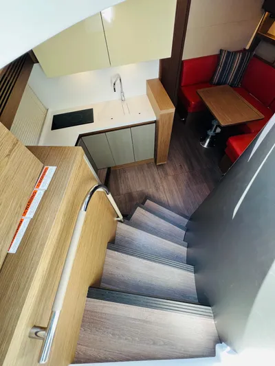 Elixir Yacht Photos Pics Interior of 2019 Beneteau Gran Turismo 46 yacht, featuring modern kitchen and dining area.