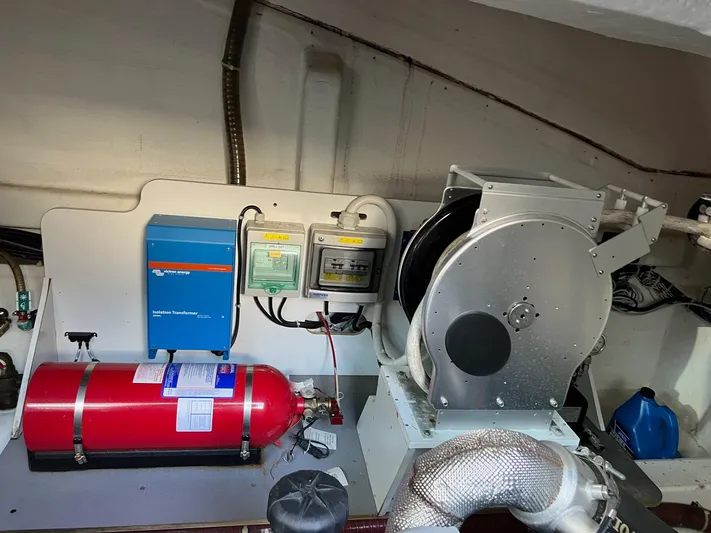 Elixir Yacht Photos Pics Engine room of 2019 Beneteau Gran Turismo 46 with fire extinguisher and equipment.