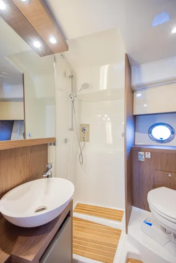 Elixir Yacht Photos Pics 2019 Beneteau Gran Turismo 46 yacht bathroom with modern fixtures and wooden accents.