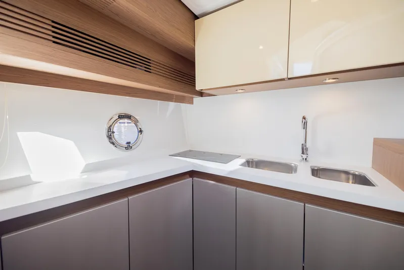 Elixir Yacht Photos Pics Modern kitchen in 2019 Beneteau Gran Turismo 46 yacht with sleek cabinetry and dual sinks.