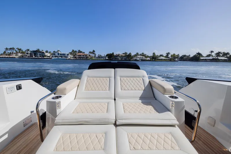Elixir Yacht Photos Pics Luxurious seating on 2019 Beneteau Gran Turismo 46 yacht, with scenic waterfront view.