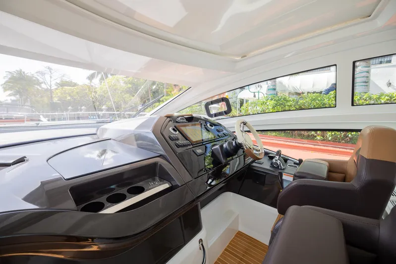 Elixir Yacht Photos Pics 2019 Beneteau Gran Turismo 46 yacht interior with modern helm and luxurious seating.