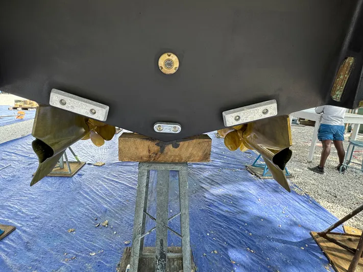 Elixir Yacht Photos Pics 2019 Beneteau Gran Turismo 46 yacht under maintenance, showing propellers and hull details.