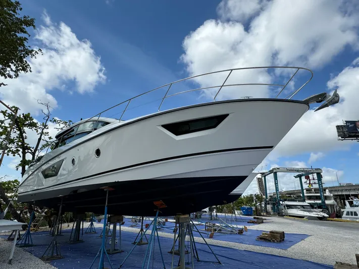 Elixir Yacht Photos Pics 2019 Beneteau Gran Turismo 46 yacht on stands, under a clear blue sky.