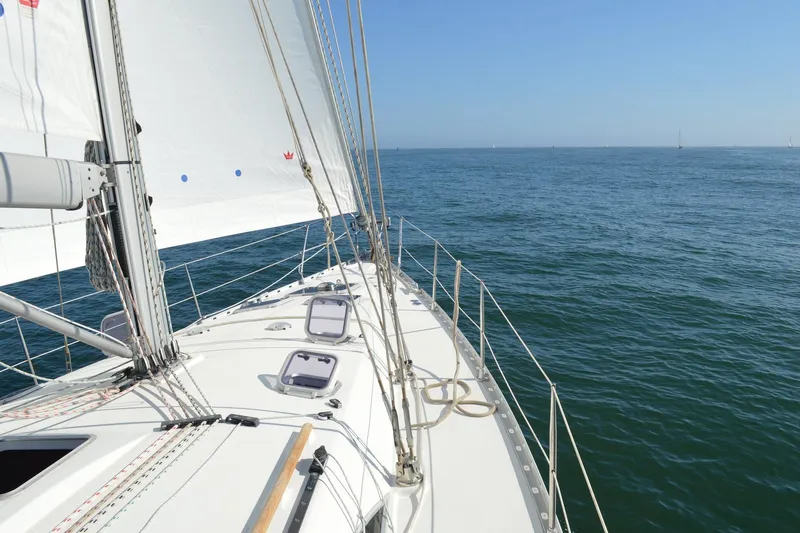 Tangent 2 Yacht Photos Pics Sailing on Jeanneau Sun Odyssey 45.2, 2002 model, on open sea under clear skies.