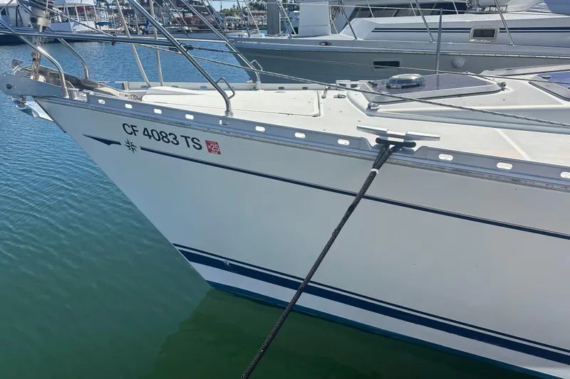 Tangent 2 Yacht Photos Pics Jeanneau Sun Odyssey 45.2 sailboat docked, 2002 model, with visible registration number.