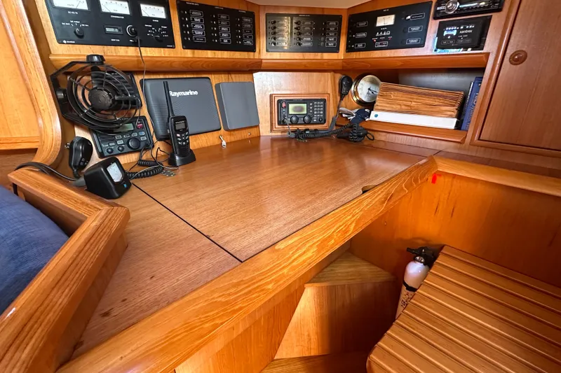 Tangent 2 Yacht Photos Pics Navigation station on 2002 Jeanneau Sun Odyssey 45.2 yacht with communication equipment.