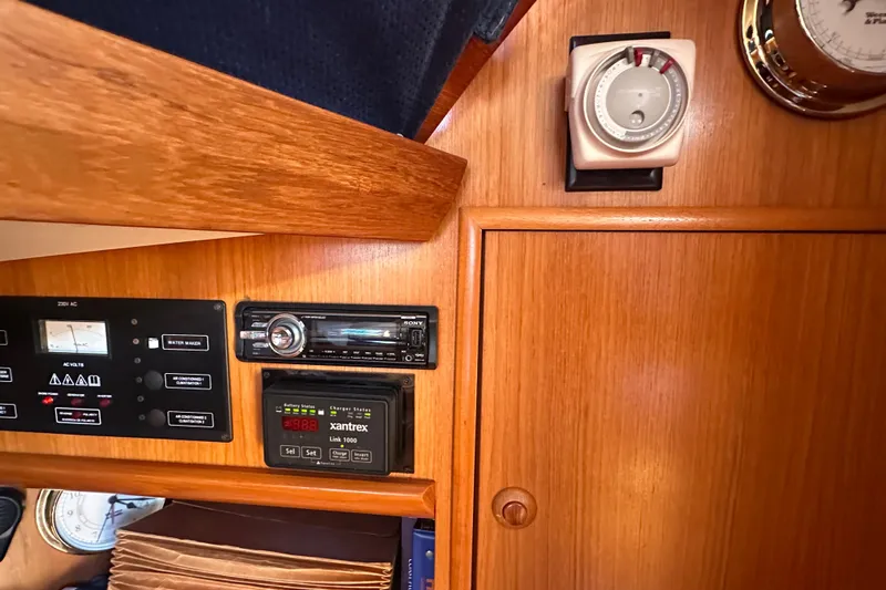 Tangent 2 Yacht Photos Pics Control panel of 2002 Jeanneau Sun Odyssey 45.2 yacht with navigation instruments.