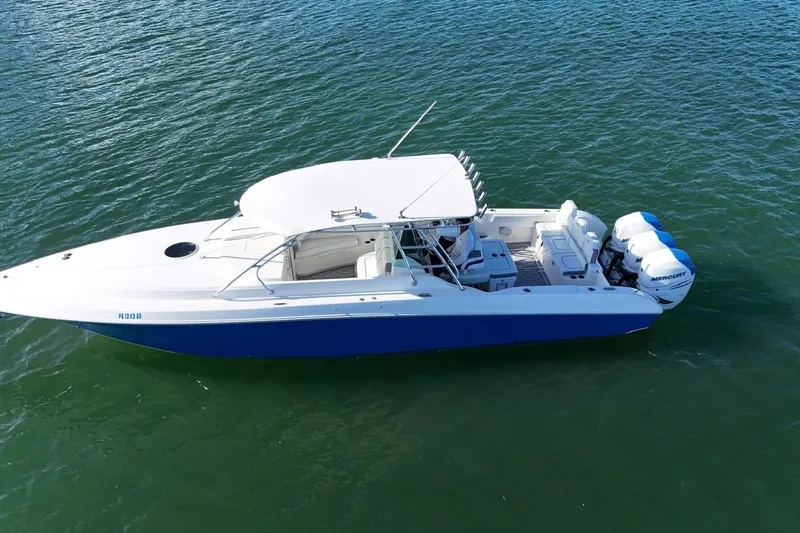  Yacht Photos Pics 2007 Fountain 38 Tournament Edition boat on water, featuring triple Mercury outboard engines.