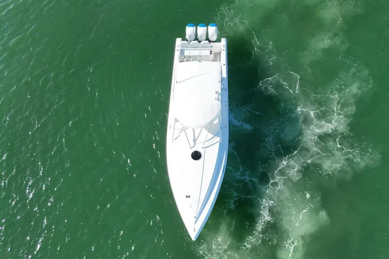  Yacht Photos Pics Aerial view of 2007 Fountain 38 Tournament Edition boat on green water.