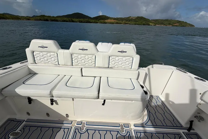  Yacht Photos Pics 2007 Fountain 38 Tournament Edition boat interior with white seating, scenic water view.
