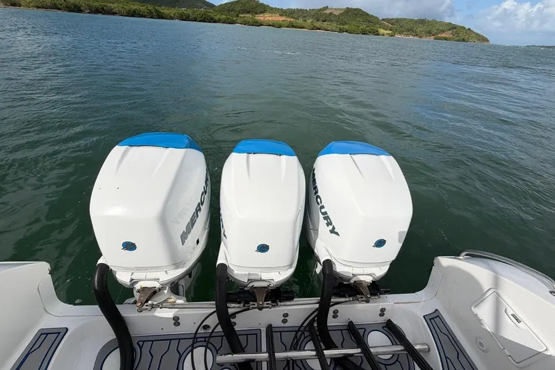  Yacht Photos Pics Three Mercury outboard engines on a 2007 Fountain 38 Tournament Edition boat, on a scenic waterway.