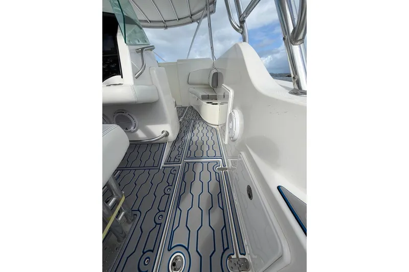  Yacht Photos Pics 2007 Fountain 38 Tournament Edition boat interior with patterned flooring and seating.