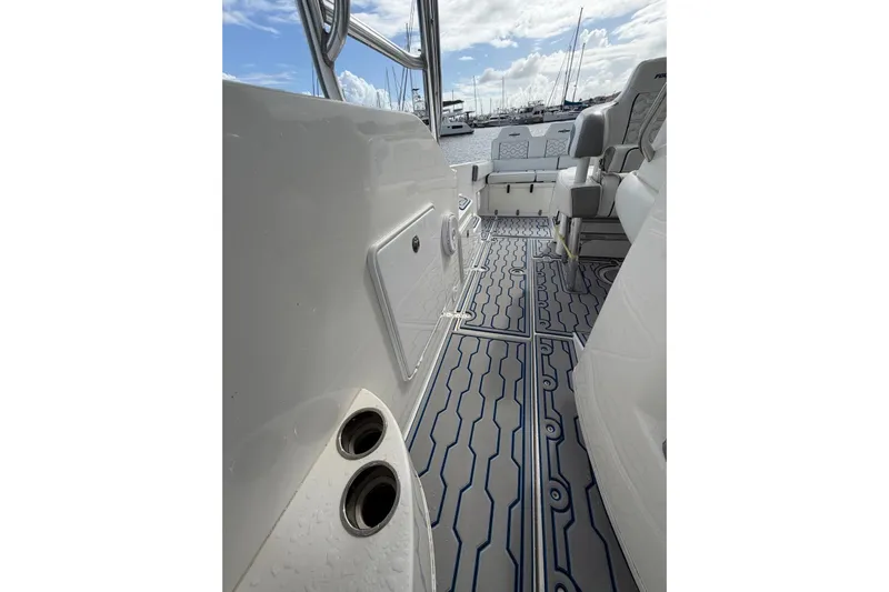  Yacht Photos Pics 2007 Fountain 38 Tournament Edition boat interior with patterned flooring and seating.