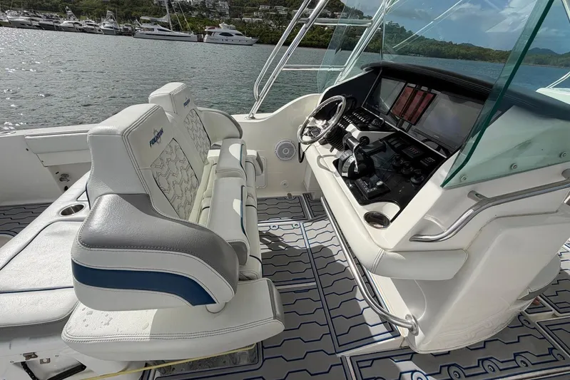  Yacht Photos Pics 2007 Fountain 38 Tournament Edition boat cockpit with modern controls and seating.