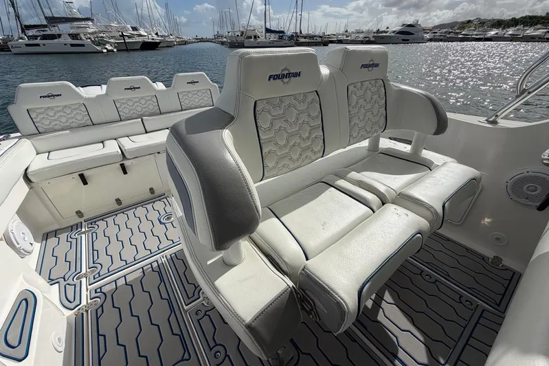  Yacht Photos Pics 2007 Fountain 38 Tournament Edition boat interior with cushioned seating and stylish flooring.