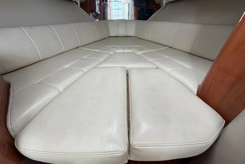  Yacht Photos Pics Interior view of 2007 Fountain 38 Tournament Edition boat cabin with beige seating.