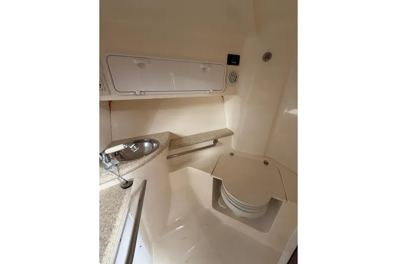  Yacht Photos Pics 2007 Fountain 38 Tournament Edition boat interior with sink and storage.