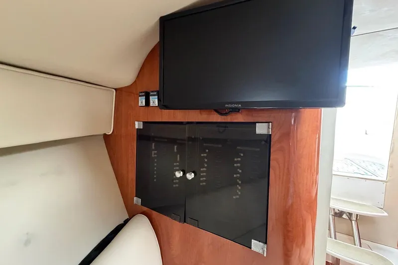  Yacht Photos Pics Interior of 2007 Fountain 38 Tournament Edition boat with TV and control panel.