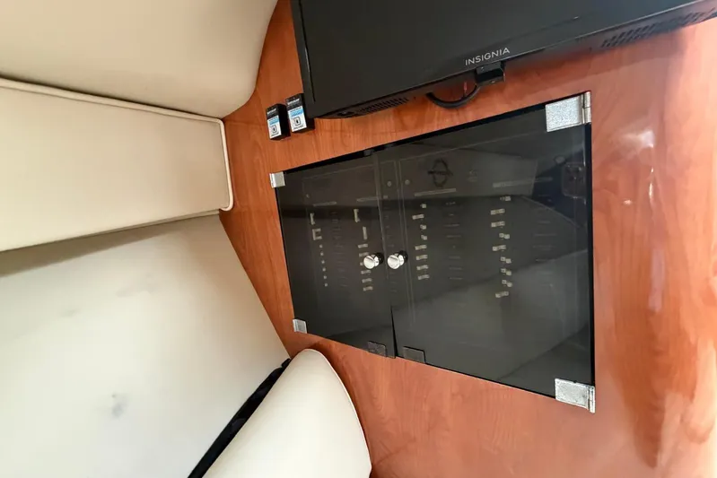  Yacht Photos Pics Interior of 2007 Fountain 38 Tournament Edition boat with control panel and TV.